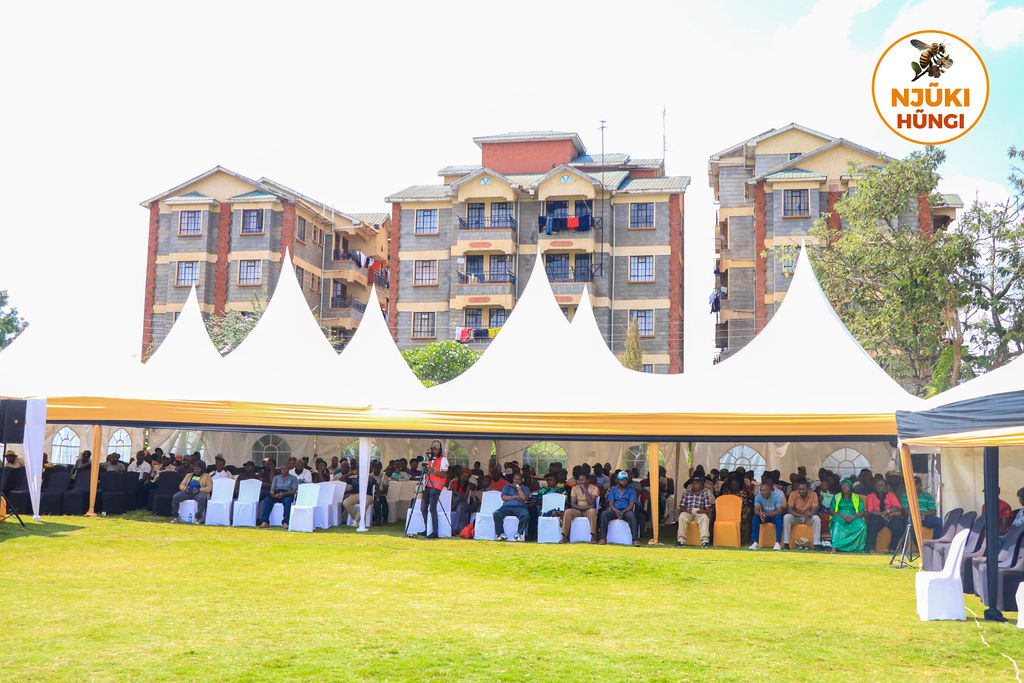 Panoramic view of the Kirira Townhall forum tents and audience