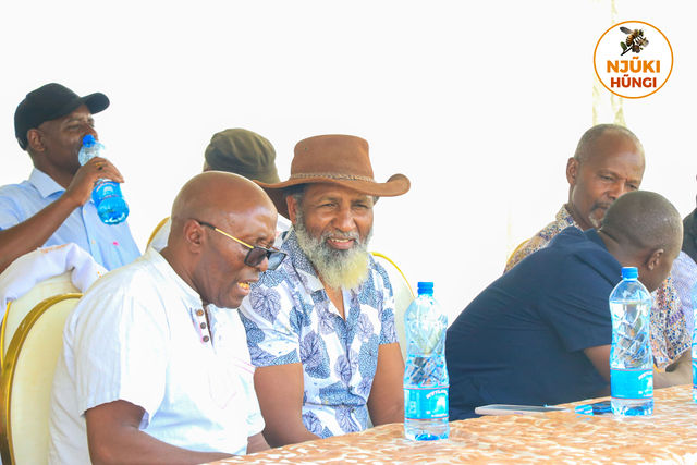 Elders seated in discussion at the forum